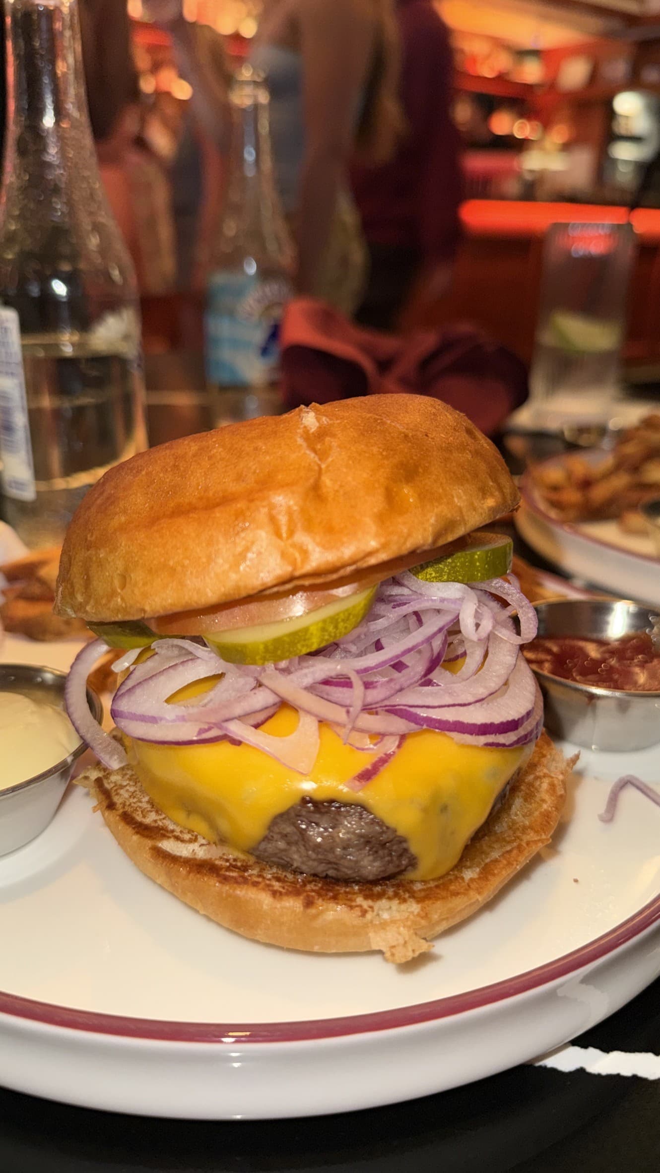 The Wagyu Burger at Yesterday's, with American cheese, thinly shaved red onion, pickles and tomato on a toasted bun